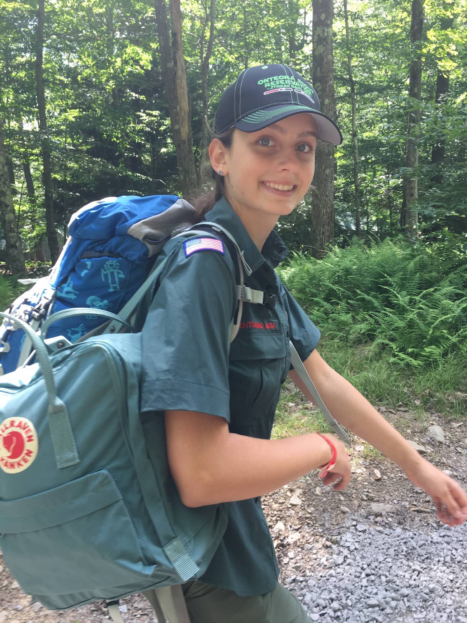 Sydney hiking with a backpack in scout uniform